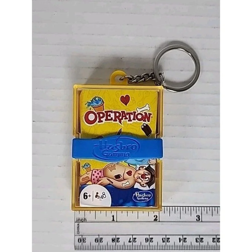 Hasbro 4 Mini Keychain Games Monopoly, Clue, Operation, Trivial Pursuit 2021